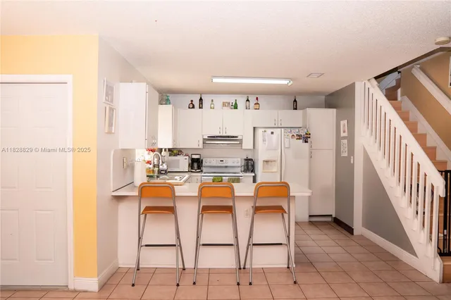 a dining room with furniture and entryway