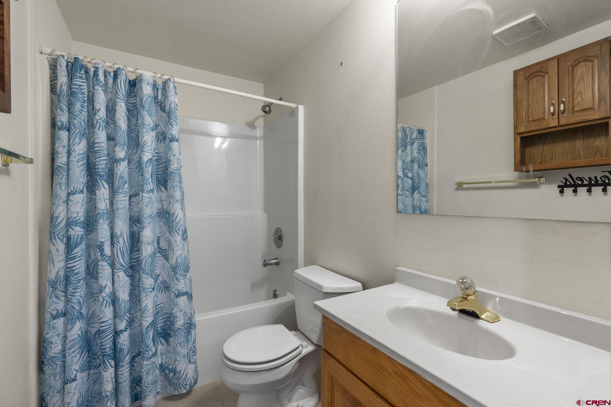720 Sawmill Road Durango, CO 81303 - Photo 27 of 41 a bathroom with a sink toilet and shower