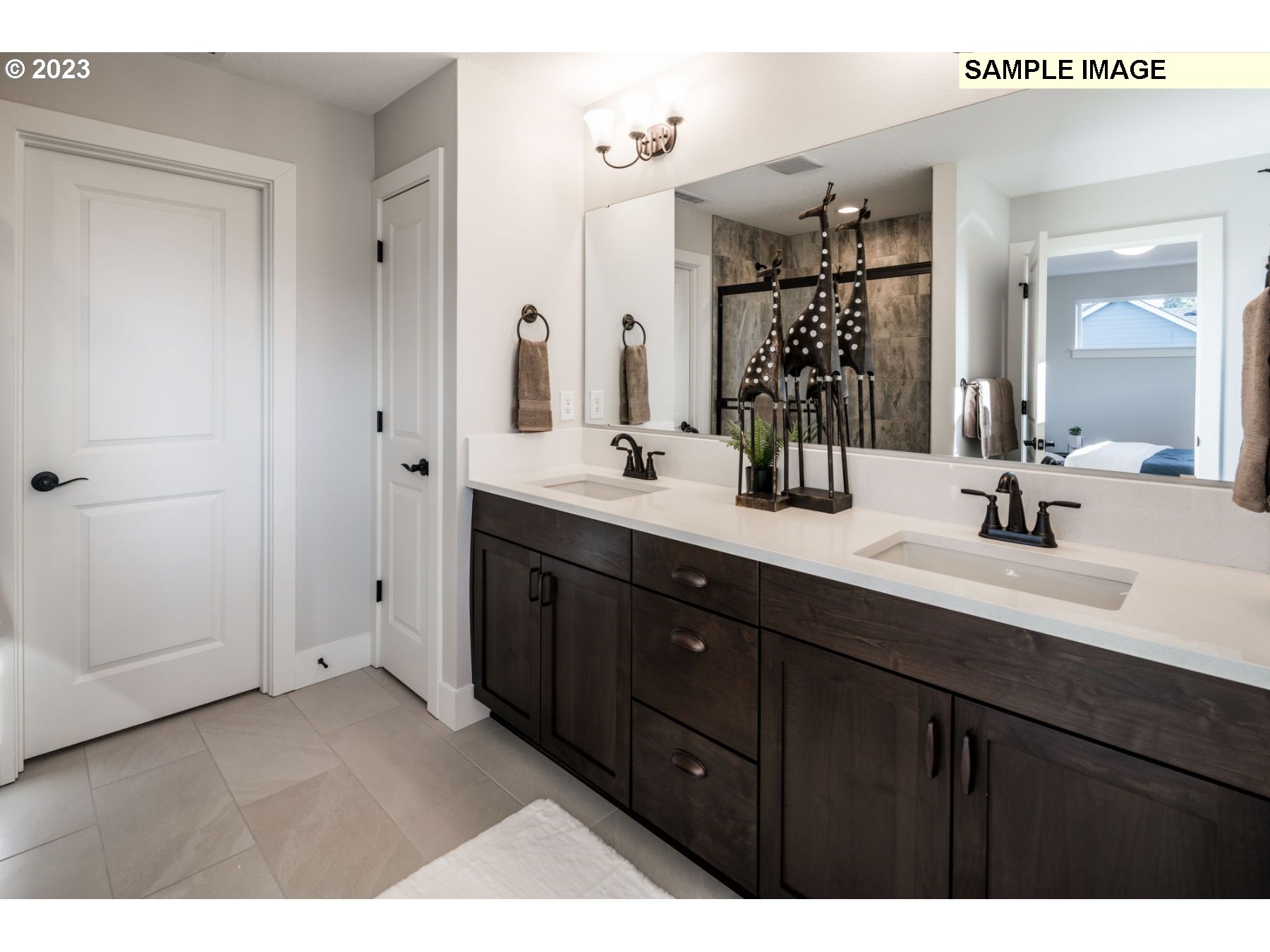 723 Northwest 174th Street Ridgefield, WA 98642 - Photo 14 of 20 a bathroom with a double vanity sink and mirror