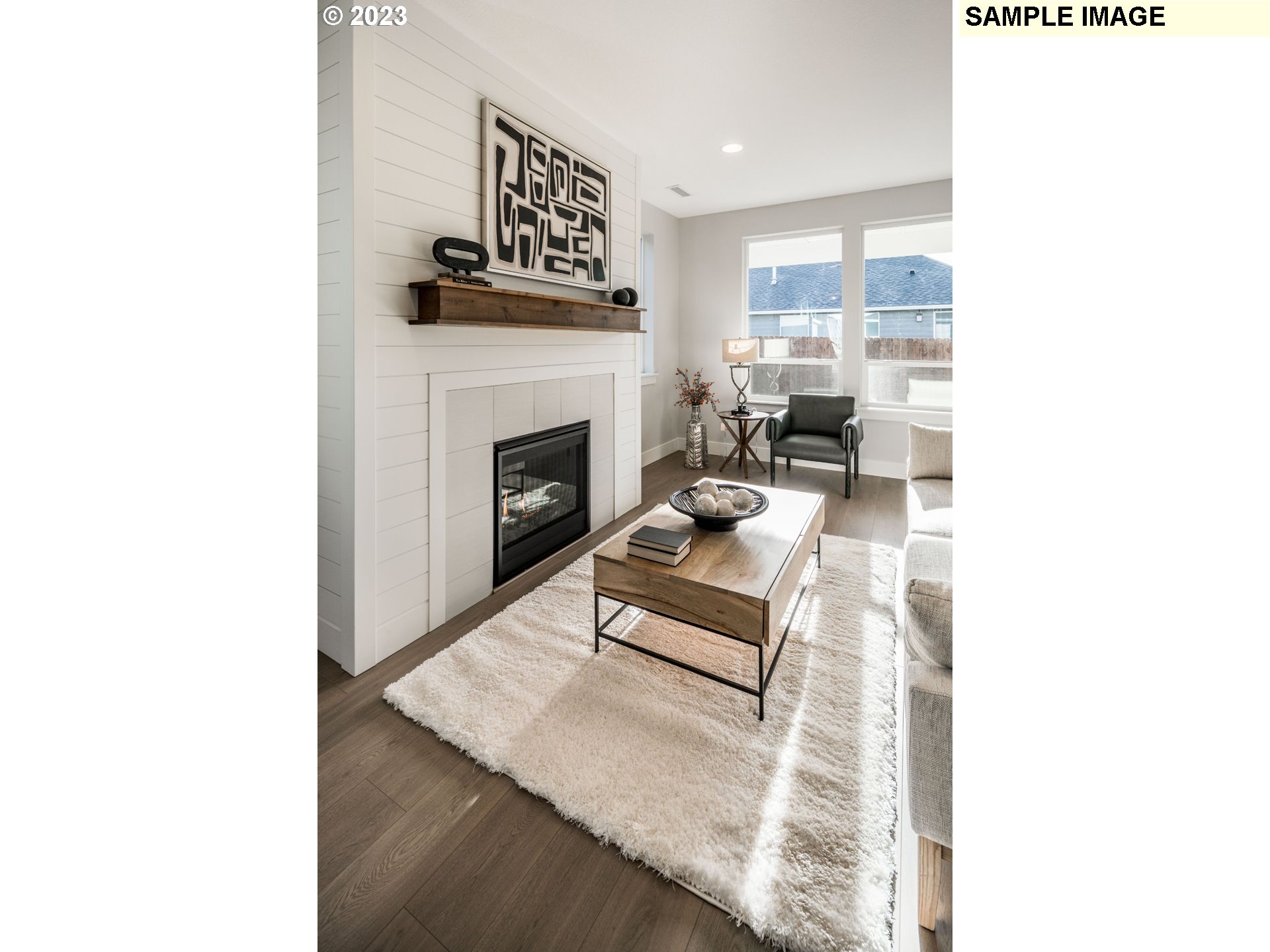 723 Northwest 174th Street Ridgefield, WA 98642 - Photo 10 of 20 a living room with furniture and a fireplace