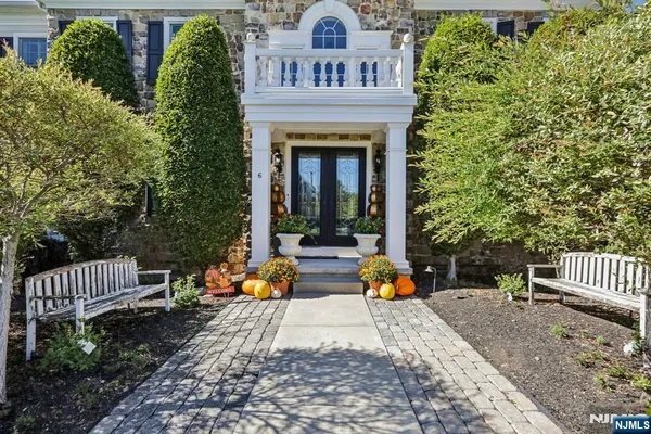 a view of house with garden and deck
