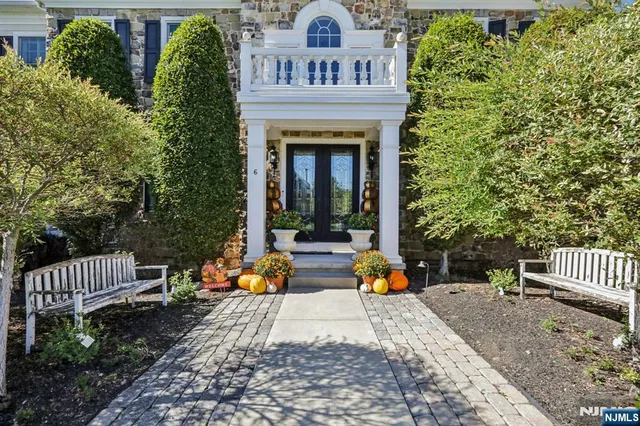 a view of house with garden and deck