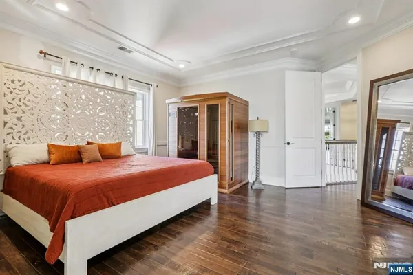 a bedroom with a large bed and a large window