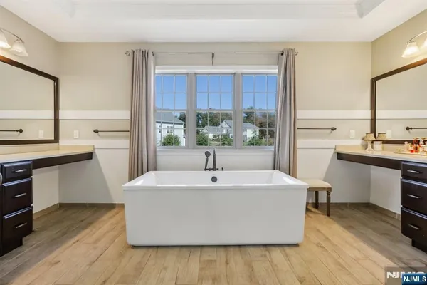 a white kitchen with sink and cabinets