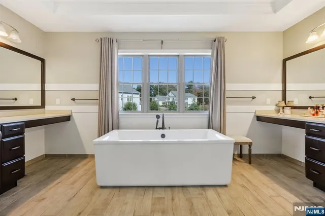 a white kitchen with sink and cabinets