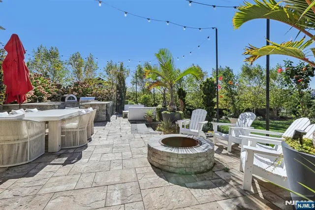 a view of a patio with chairs and plants