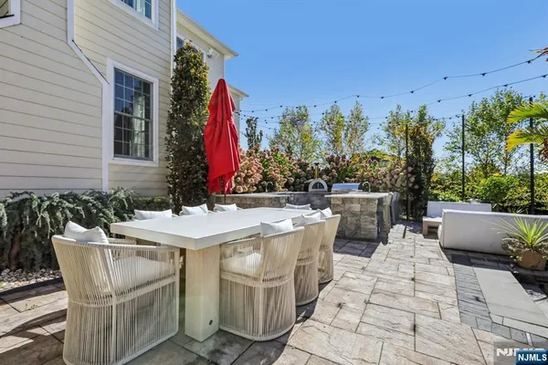 a view of a dinning tables and chairs in a patio