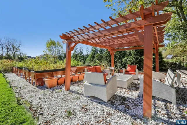 a front view of a house with a yard table and chairs