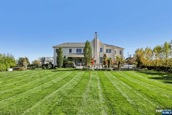 a view of a garden with a building in the background