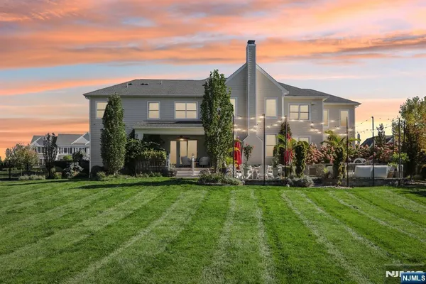 an aerial view of residential house with outdoor space and swimming pool
