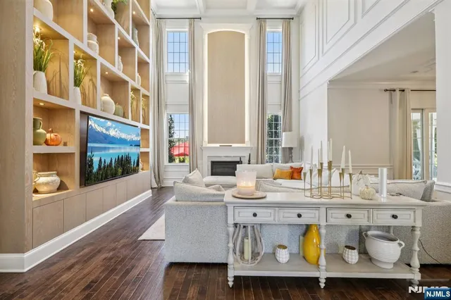 a living room with kitchen island furniture and a painting on the wall