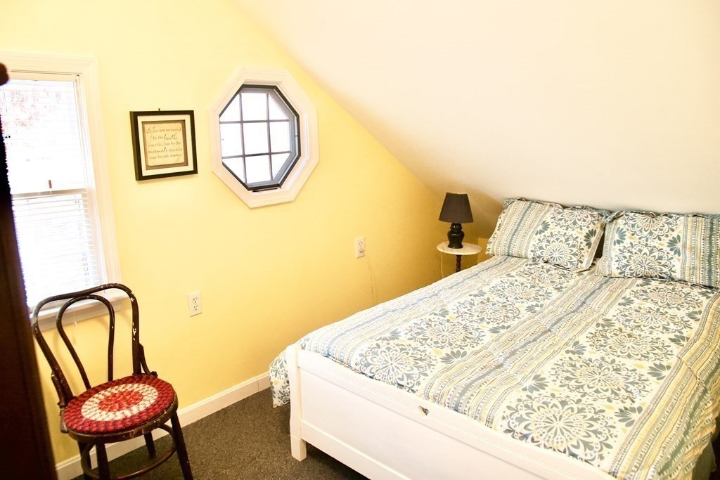 64 Lincoln Point Road Charlton, MA 01507 - Photo 12 of 28 a bedroom with a bed a mirror and wall