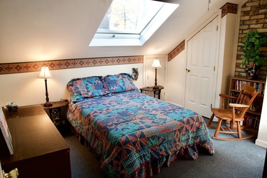 64 Lincoln Point Road Charlton, MA 01507 - Photo 15 of 28 a bedroom with a bed and a night stand