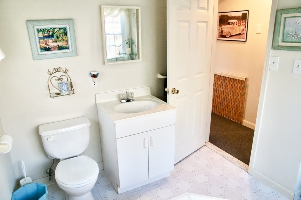 64 Lincoln Point Road Charlton, MA 01507 - Photo 17 of 28 a bathroom with a toilet sink and mirror