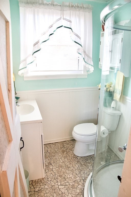 64 Lincoln Point Road Charlton, MA 01507 - Photo 10 of 28 a bathroom with a toilet sink and mirror