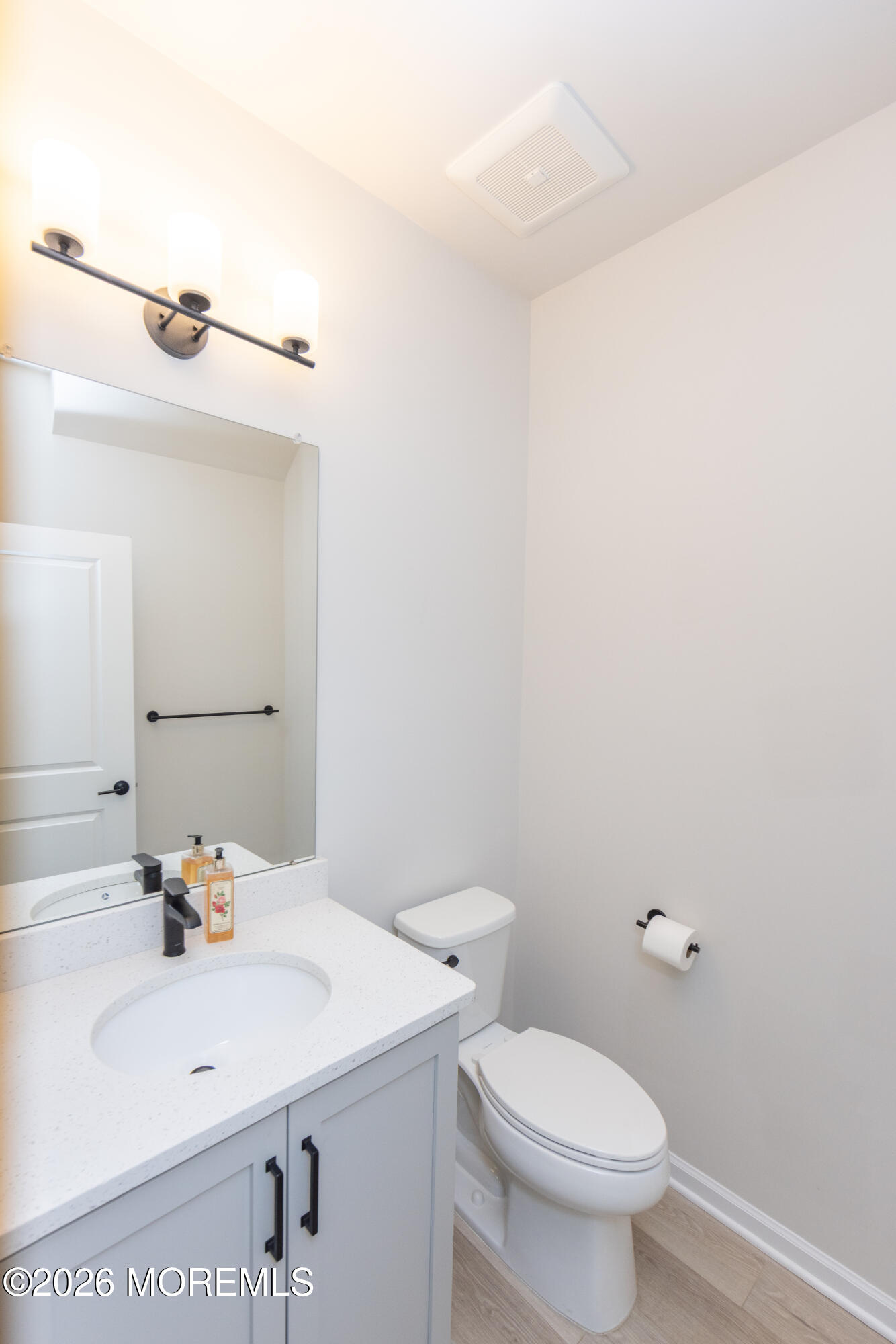 16 Chapel Lane Neptune, NJ 07753 - Photo 13 of 27 a bathroom with a sink a toilet and mirror