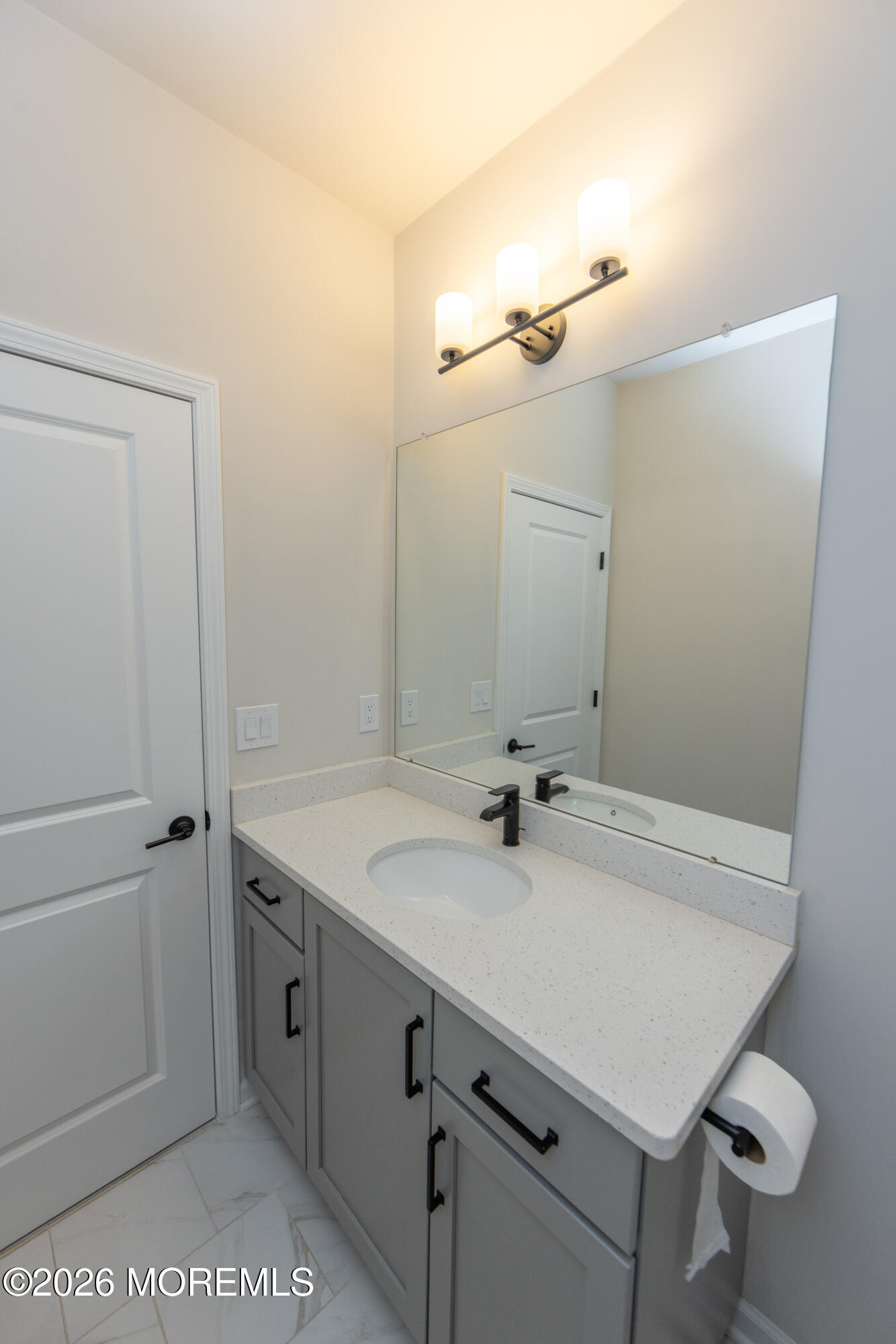 16 Chapel Lane Neptune, NJ 07753 - Photo 15 of 27 a bathroom with a sink and a mirror