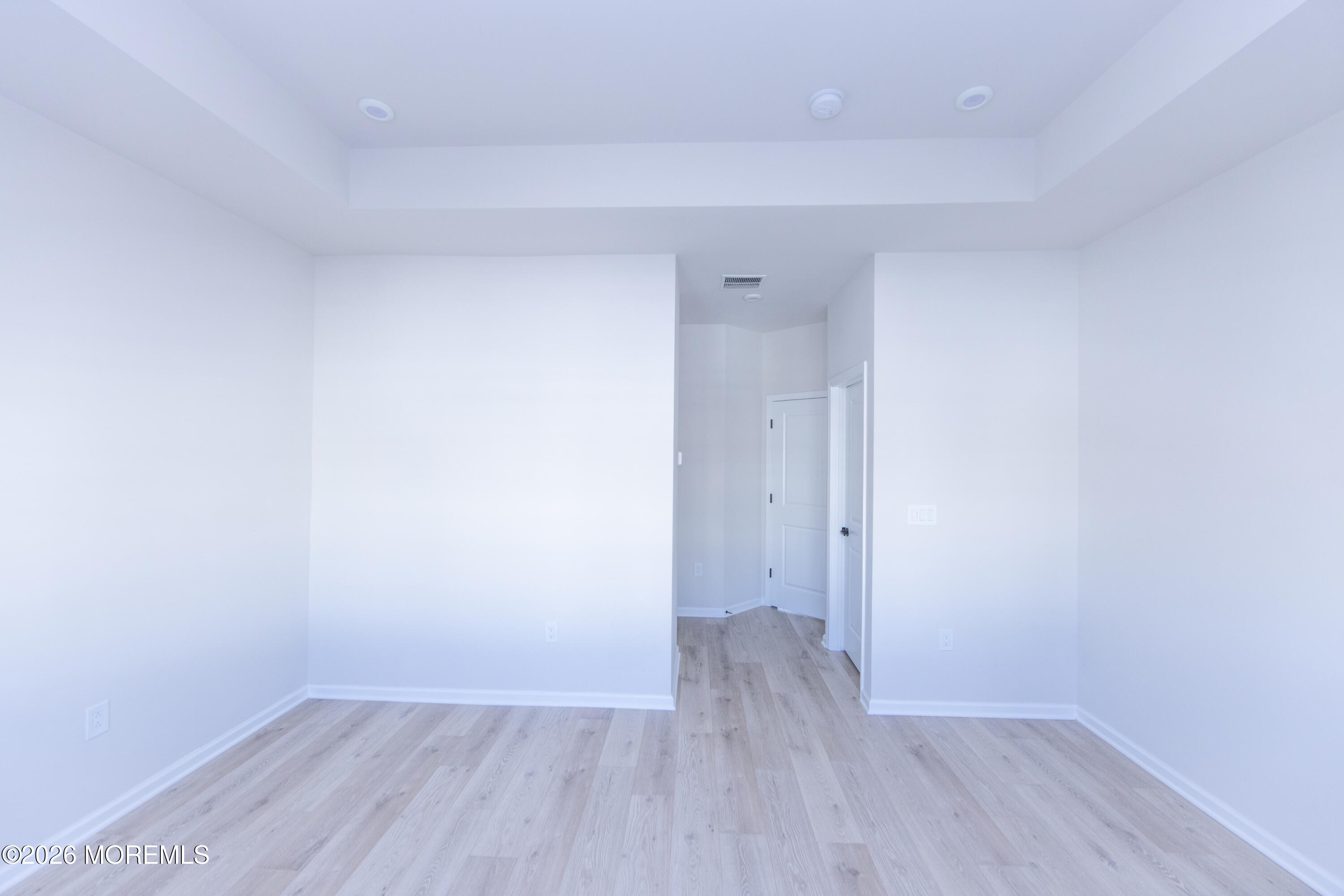 16 Chapel Lane Neptune, NJ 07753 - Photo 21 of 27 a view of an empty room with wooden floor