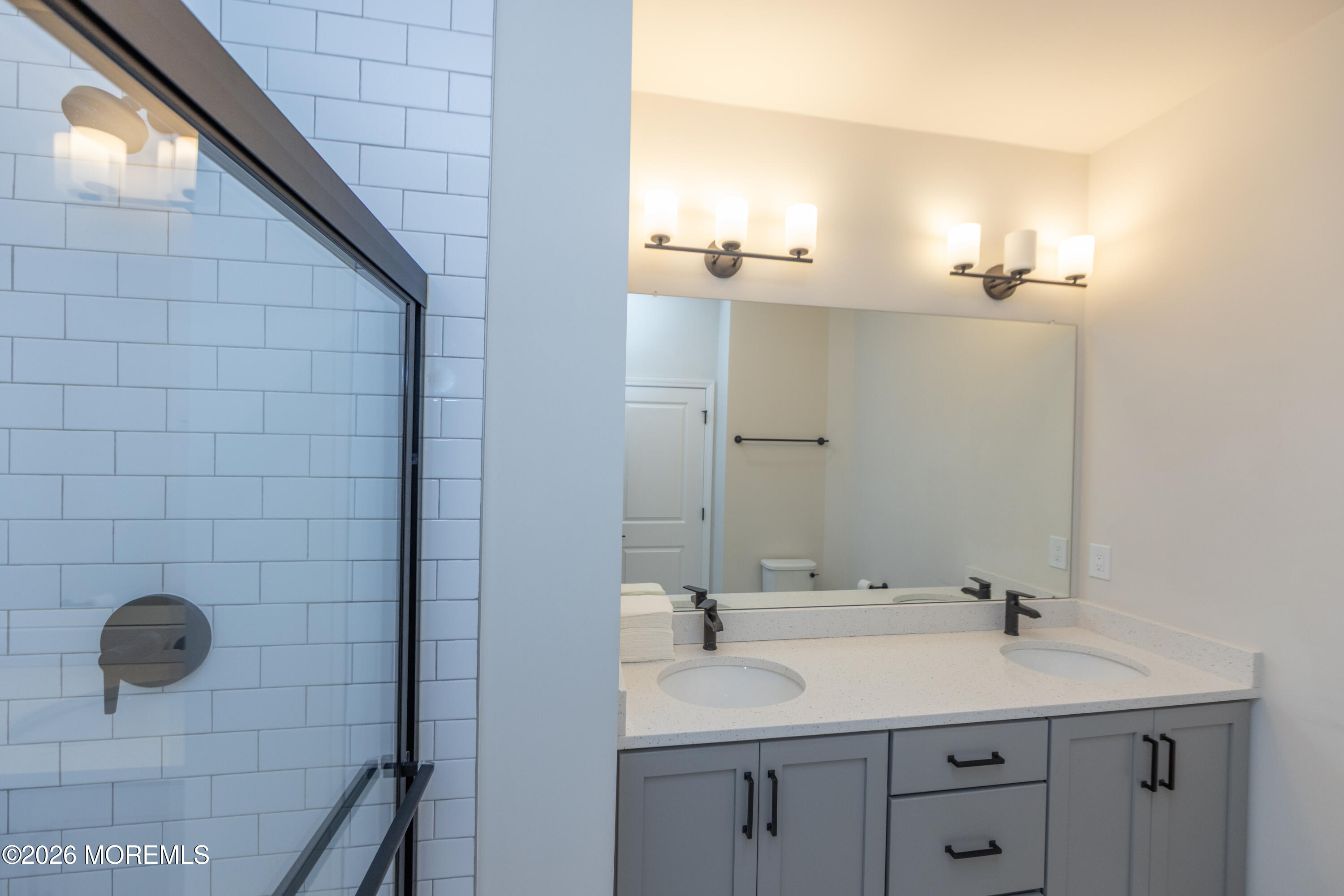16 Chapel Lane Neptune, NJ 07753 - Photo 22 of 27 a bathroom with a sink and mirror