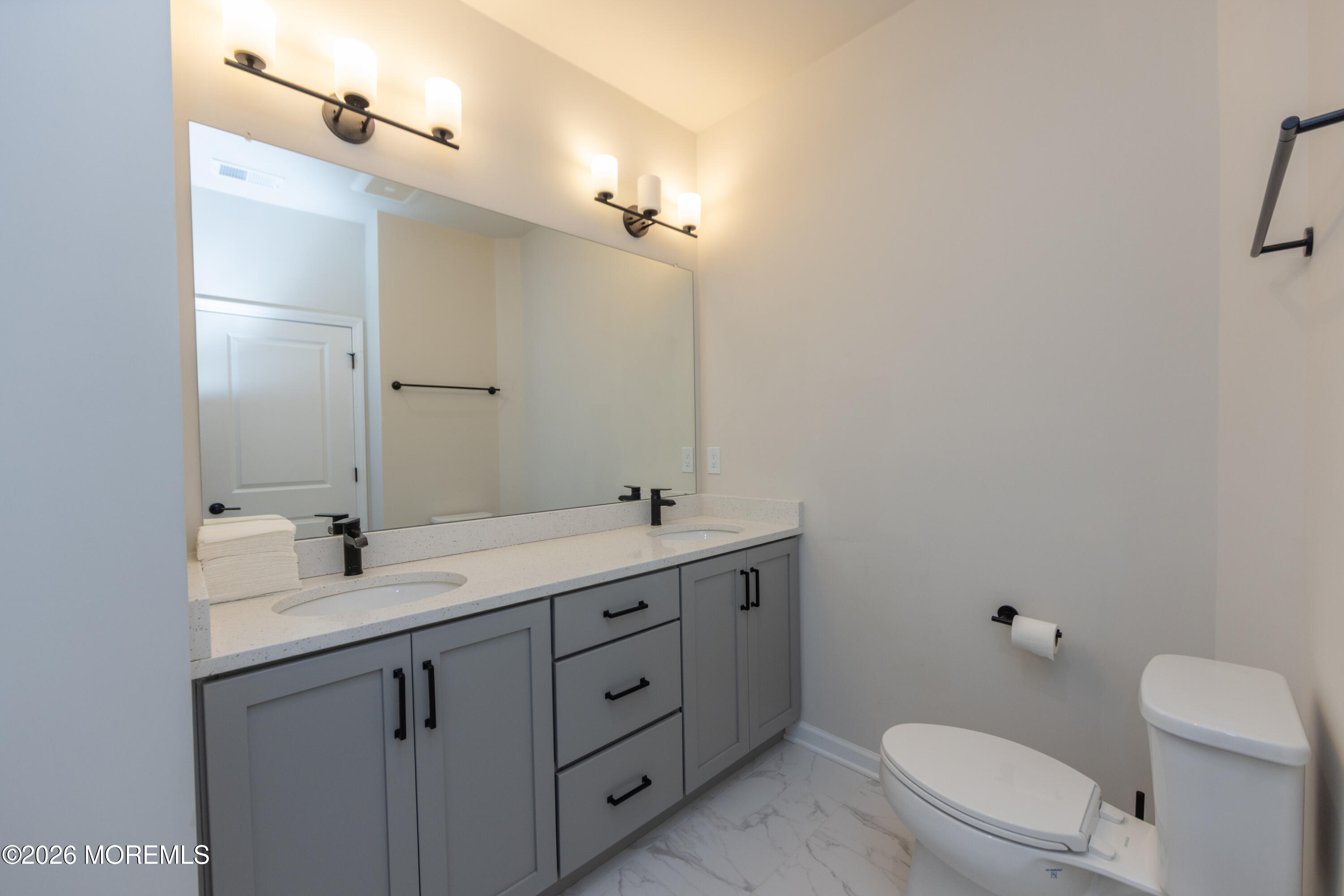 16 Chapel Lane Neptune, NJ 07753 - Photo 23 of 27 a bathroom with a toilet sink and mirror