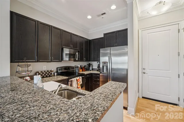 a kitchen with a sink stove and cabinets