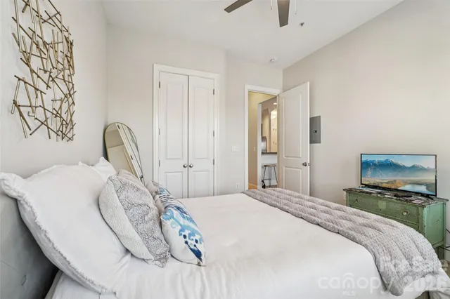 a view of a hallway with wooden shelves