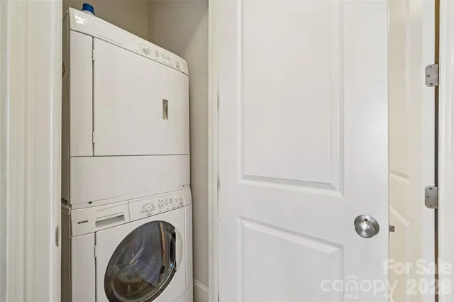a bathroom with a sink vanity mirror and toilet
