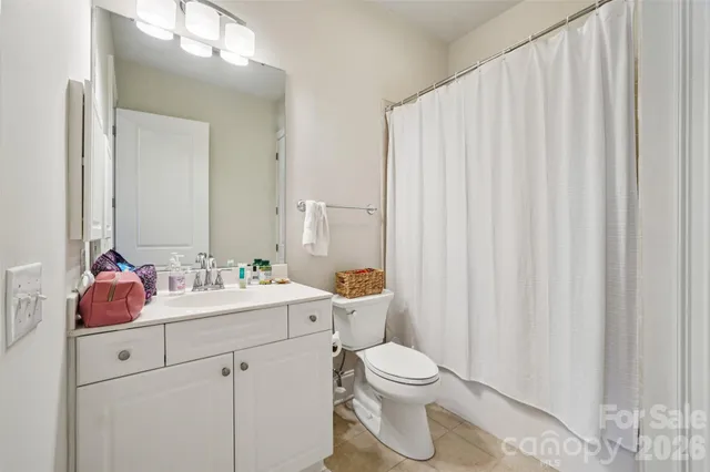 a city street lined with buildings and cars parked in front of it