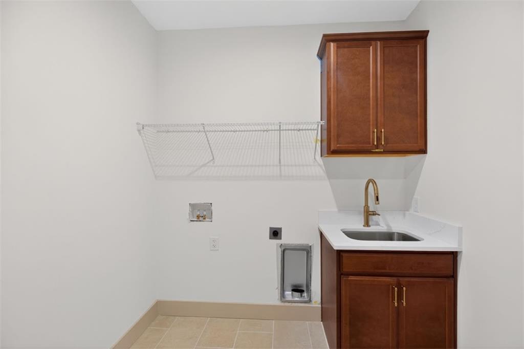 1416 Morgan Road Bremen, GA 30110 - Photo 30 of 32 a bathroom with a sink a vanity and mirror