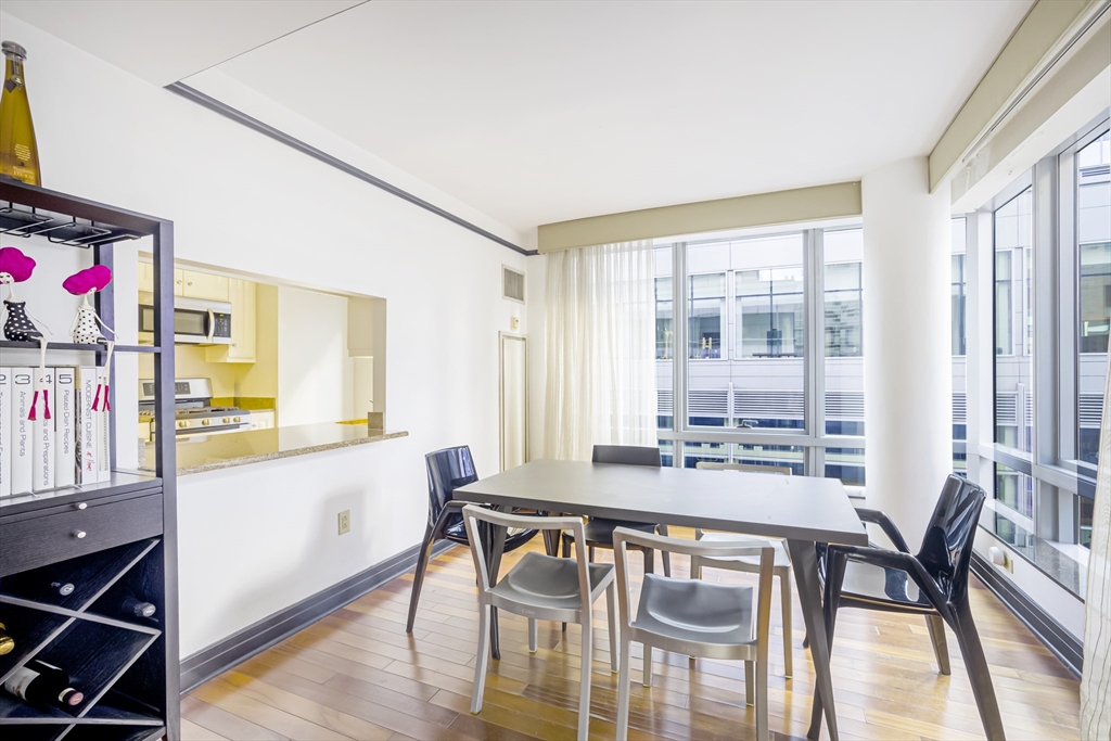 3 Avery Street, Unit 804 Boston, MA 02111 - Photo 8 of 21 a view of a dining room with furniture window and wooden floor