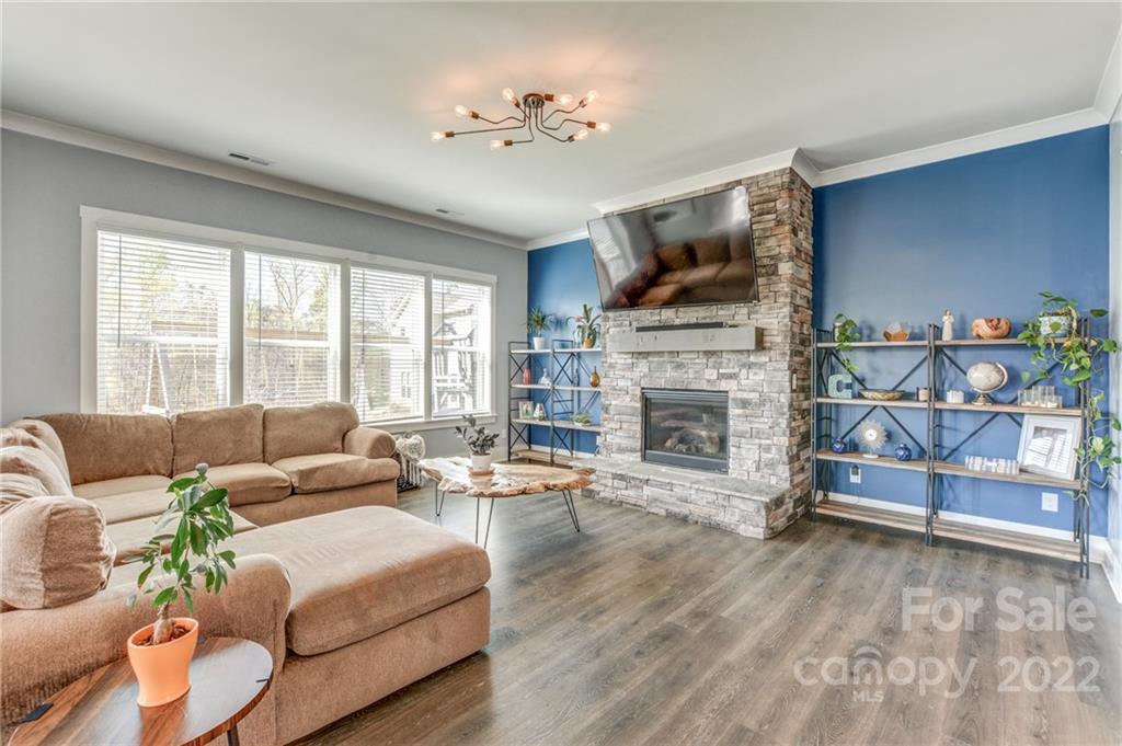 1106 Currituck Way York, SC 29745 - Photo 16 of 45 a living room with furniture fireplace and flat screen tv