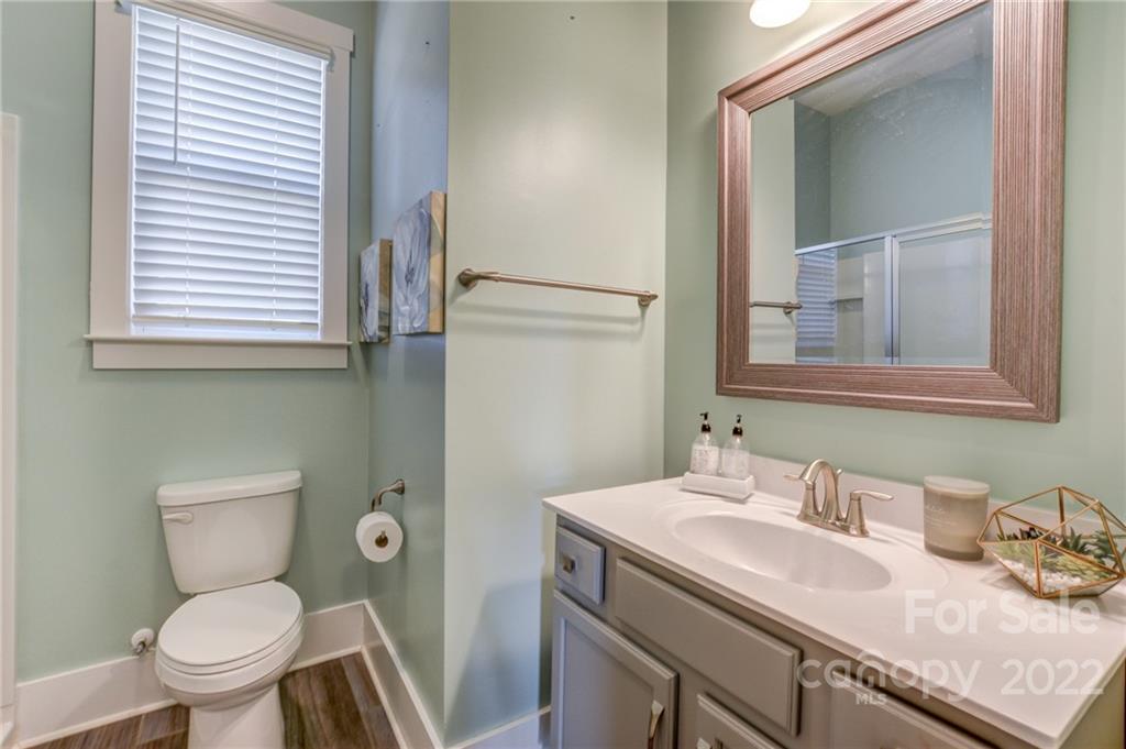 1106 Currituck Way York, SC 29745 - Photo 20 of 45 a bathroom with a granite countertop toilet sink and mirror