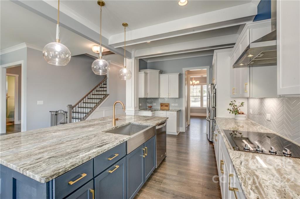 1106 Currituck Way York, SC 29745 - Photo 22 of 45 a kitchen with granite countertop stove and refrigerator