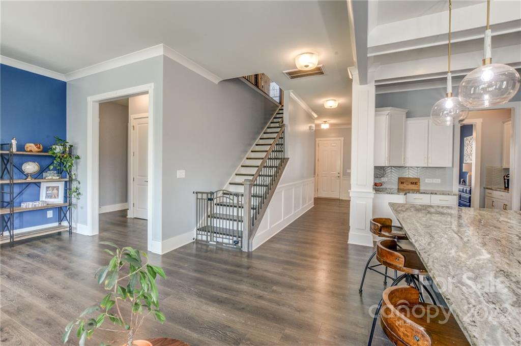 1106 Currituck Way York, SC 29745 - Photo 23 of 45 a view of a hallway with wooden floor and staircase