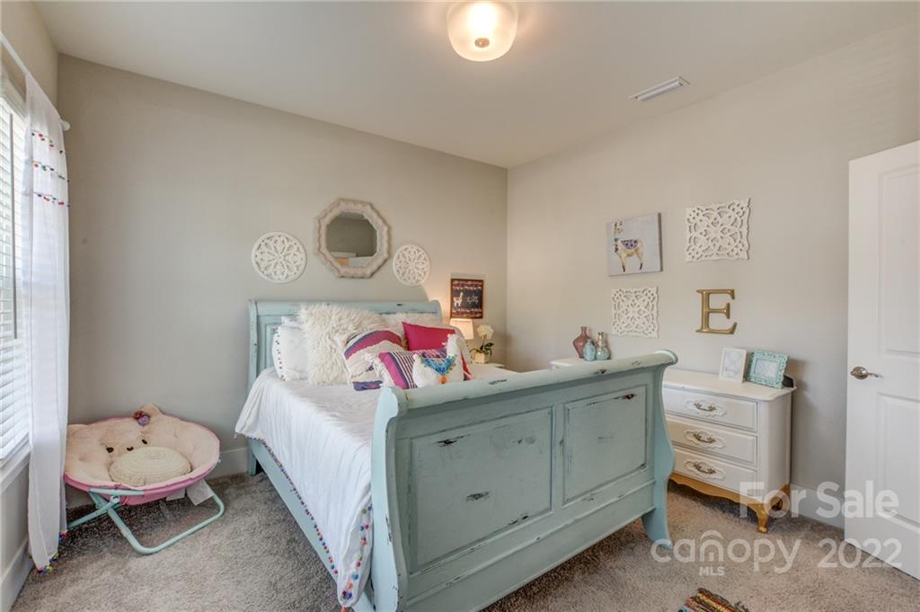 1106 Currituck Way York, SC 29745 - Photo 26 of 45 a bedroom with a bed and a window