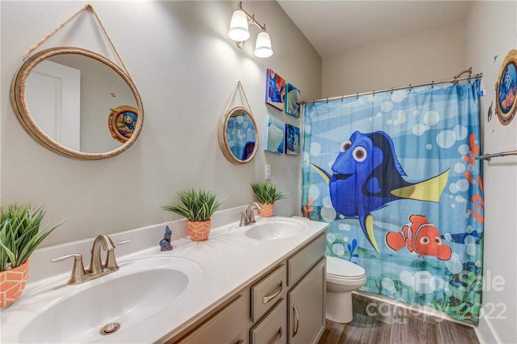 1106 Currituck Way York, SC 29745 - Photo 27 of 45 a bathroom with a sink mirror vanity and toilet