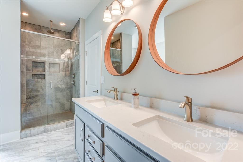 1106 Currituck Way York, SC 29745 - Photo 37 of 45 a bathroom with a sink and a mirror