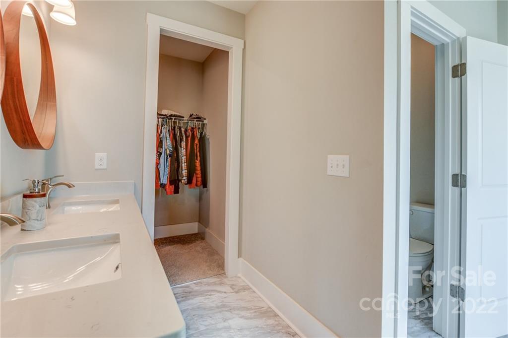 1106 Currituck Way York, SC 29745 - Photo 38 of 45 a bathroom with a sink and a mirror