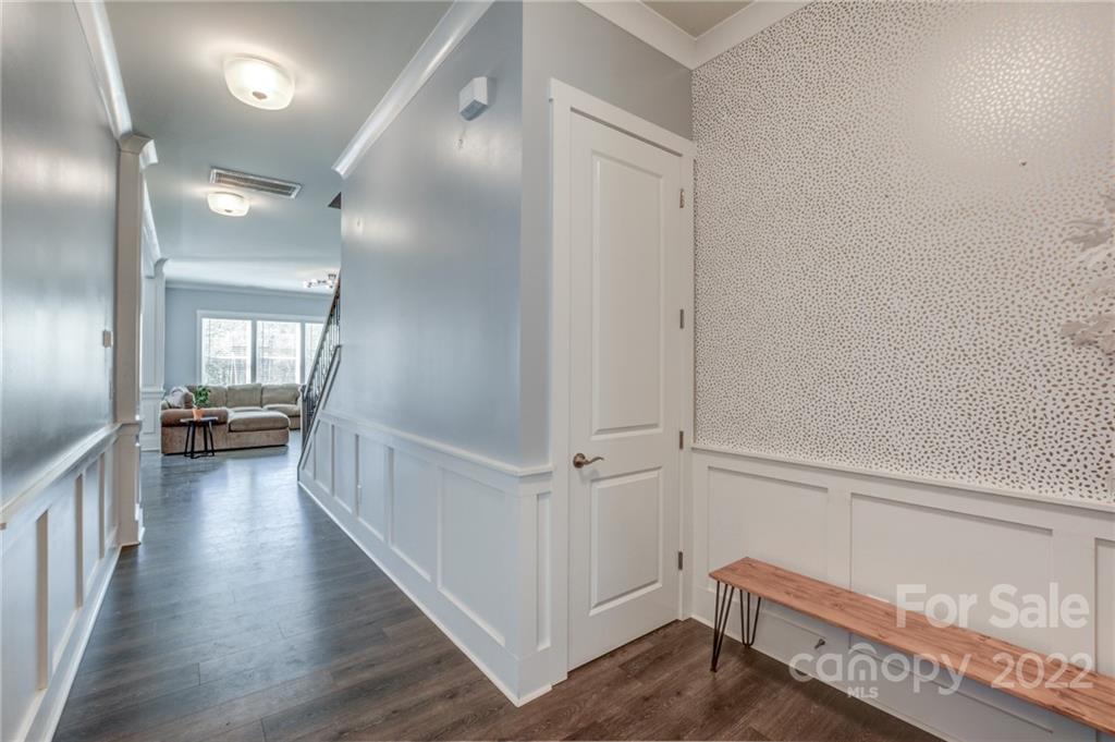 1106 Currituck Way York, SC 29745 - Photo 4 of 45 a view of a hallway with wooden floor and staircase