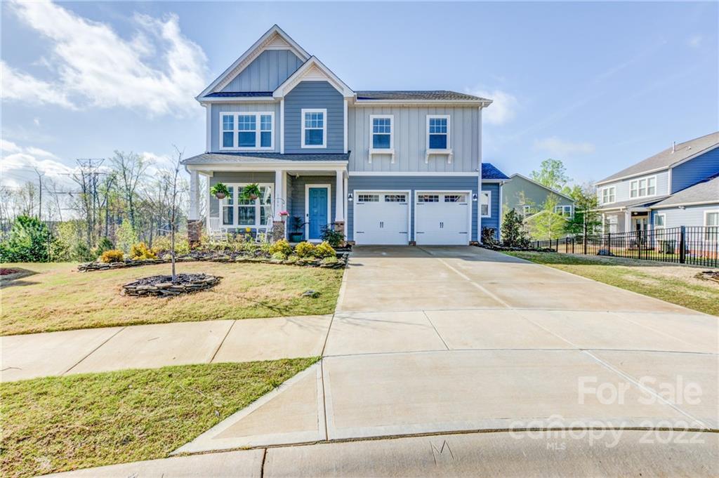 1106 Currituck Way York, SC 29745 - Photo 44 of 45 a view of a brick house with many windows and a yard
