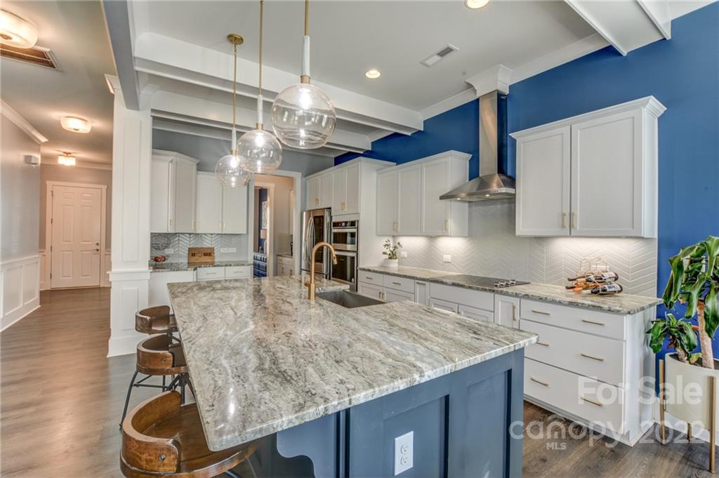 1106 Currituck Way York, SC 29745 - Photo 8 of 45 a kitchen with kitchen island a counter top space a sink stainless steel appliances and cabinets
