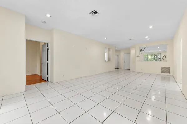 a view of an empty room and a window