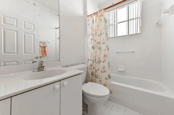 a bathroom with a sink a toilet and a bathtub