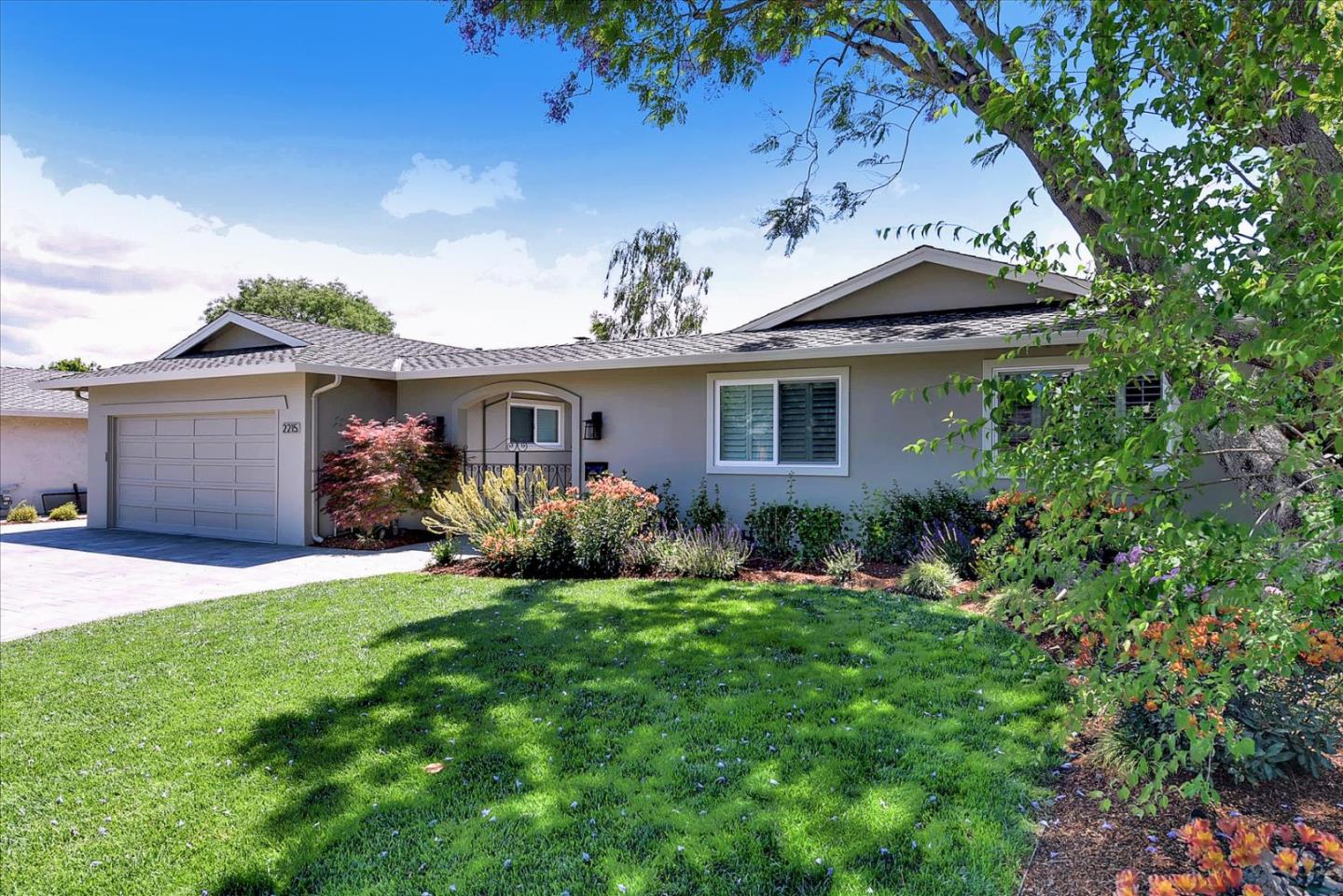 2215 Constitution Drive San Jose, CA 95124 - Photo 2 of 36 a front view of a house with a garden