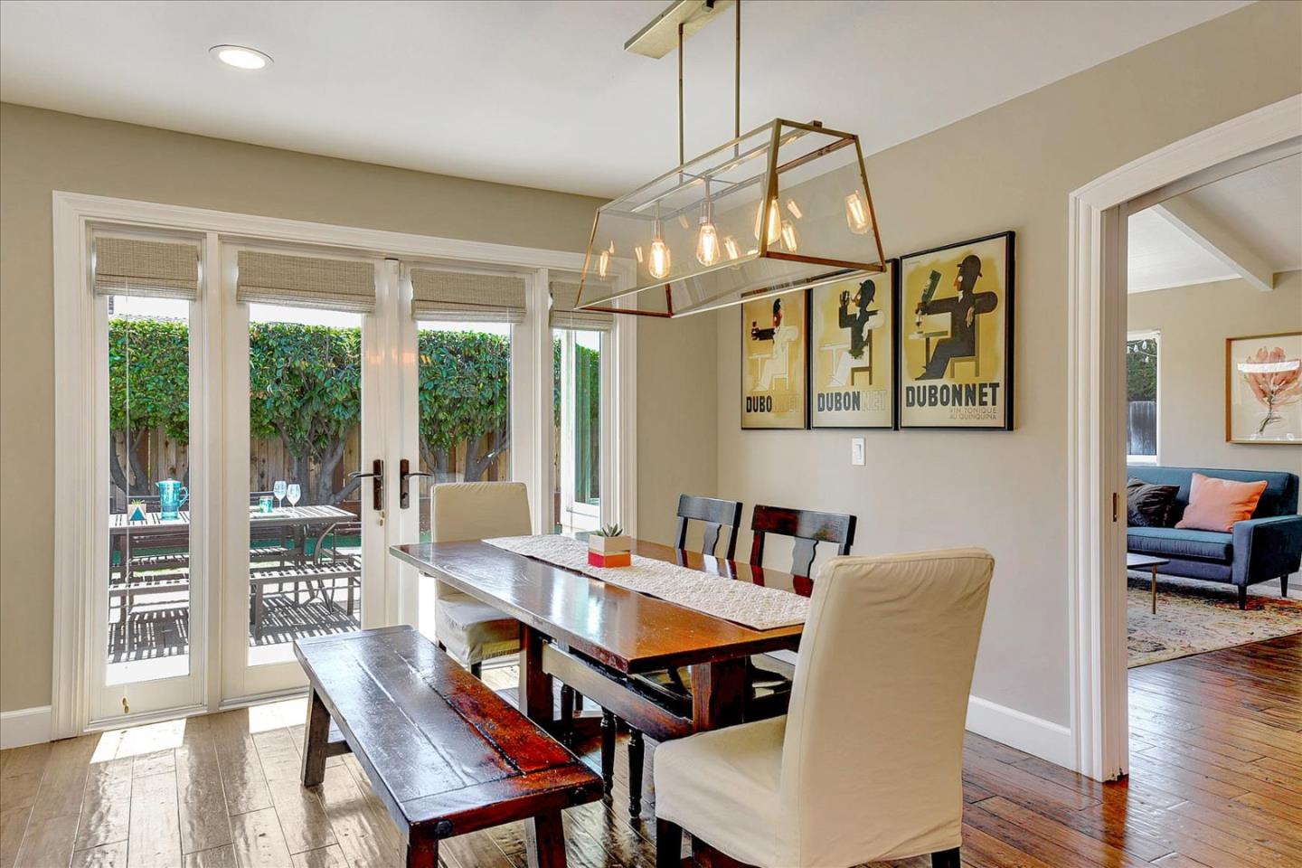 2215 Constitution Drive San Jose, CA 95124 - Photo 14 of 36 a dining room with wooden floor a chandelier a wooden table and chairs