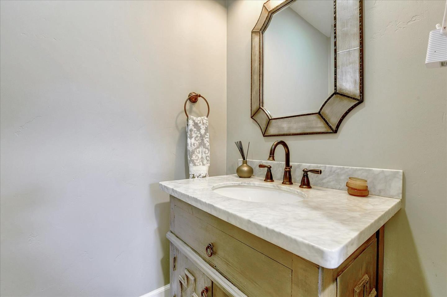 2215 Constitution Drive San Jose, CA 95124 - Photo 16 of 36 a bathroom with a sink and a mirror