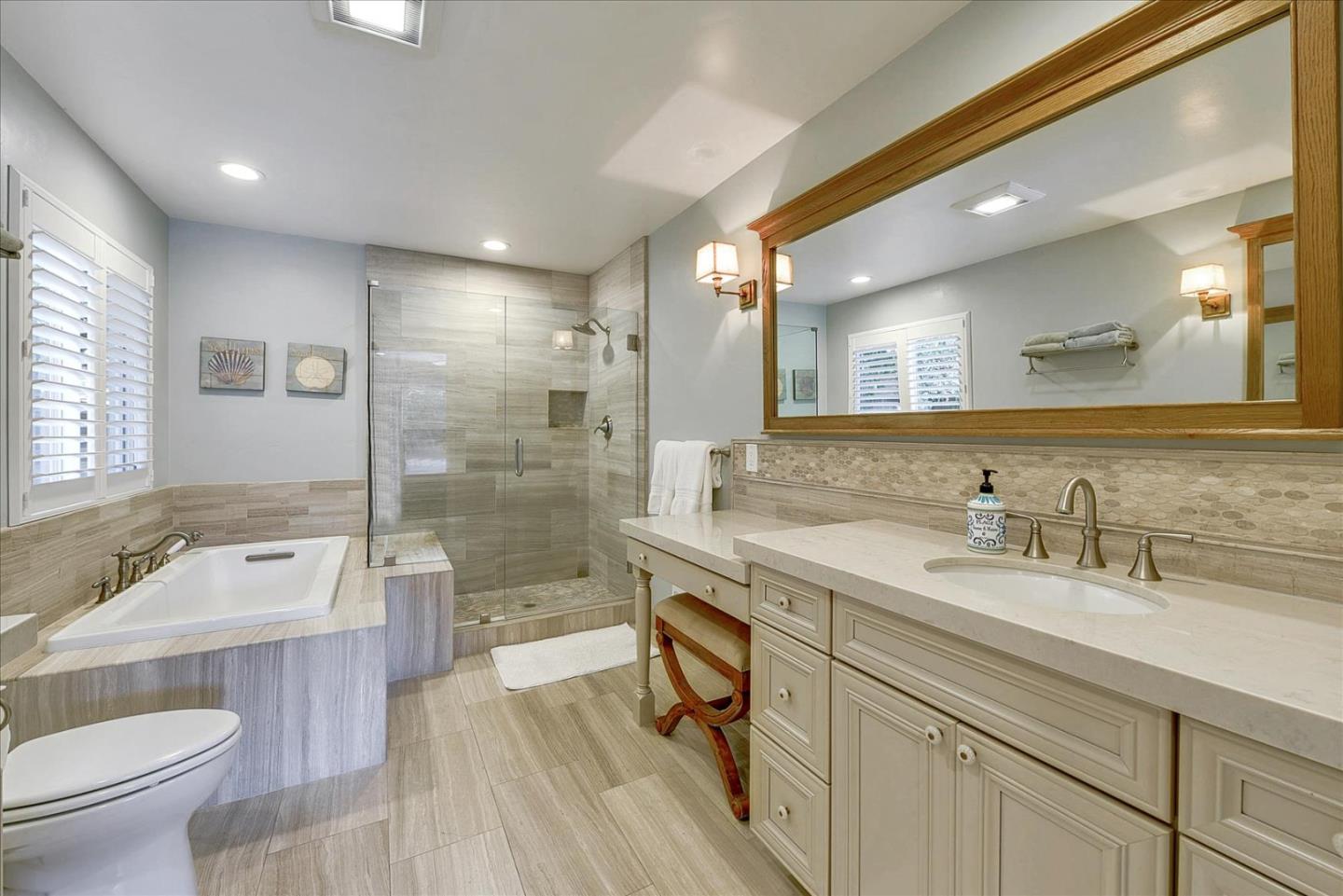 2215 Constitution Drive San Jose, CA 95124 - Photo 24 of 36 a bathroom with a sink a toilet a mirror and bathtub