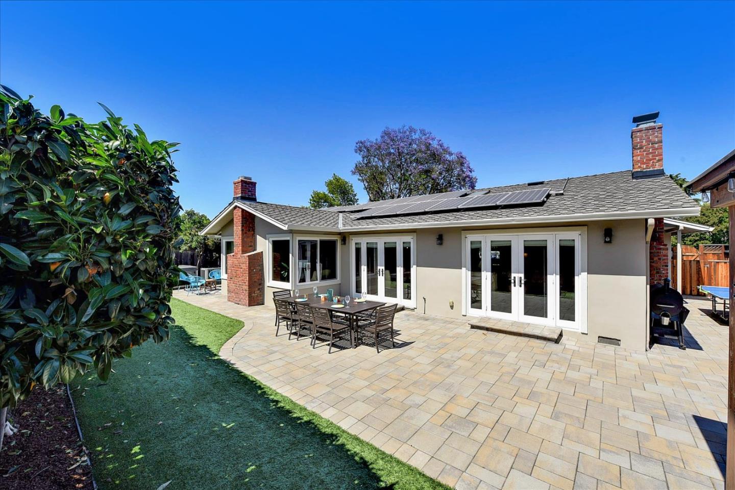 2215 Constitution Drive San Jose, CA 95124 - Photo 25 of 36 a front view of a house with a yard table and chairs