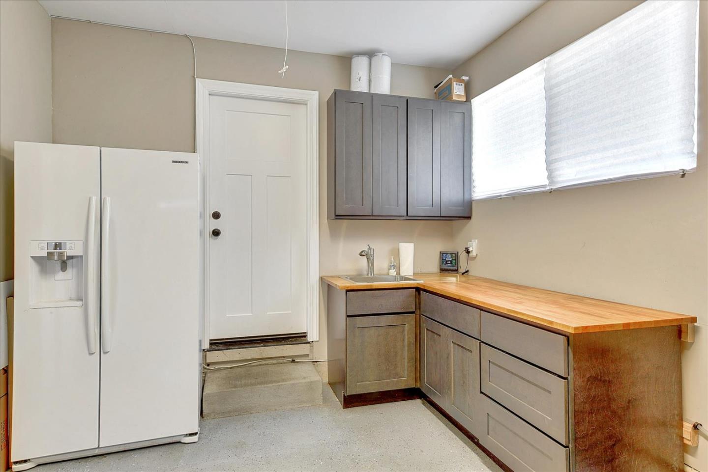 2215 Constitution Drive San Jose, CA 95124 - Photo 35 of 36 a kitchen with a sink and cabinets