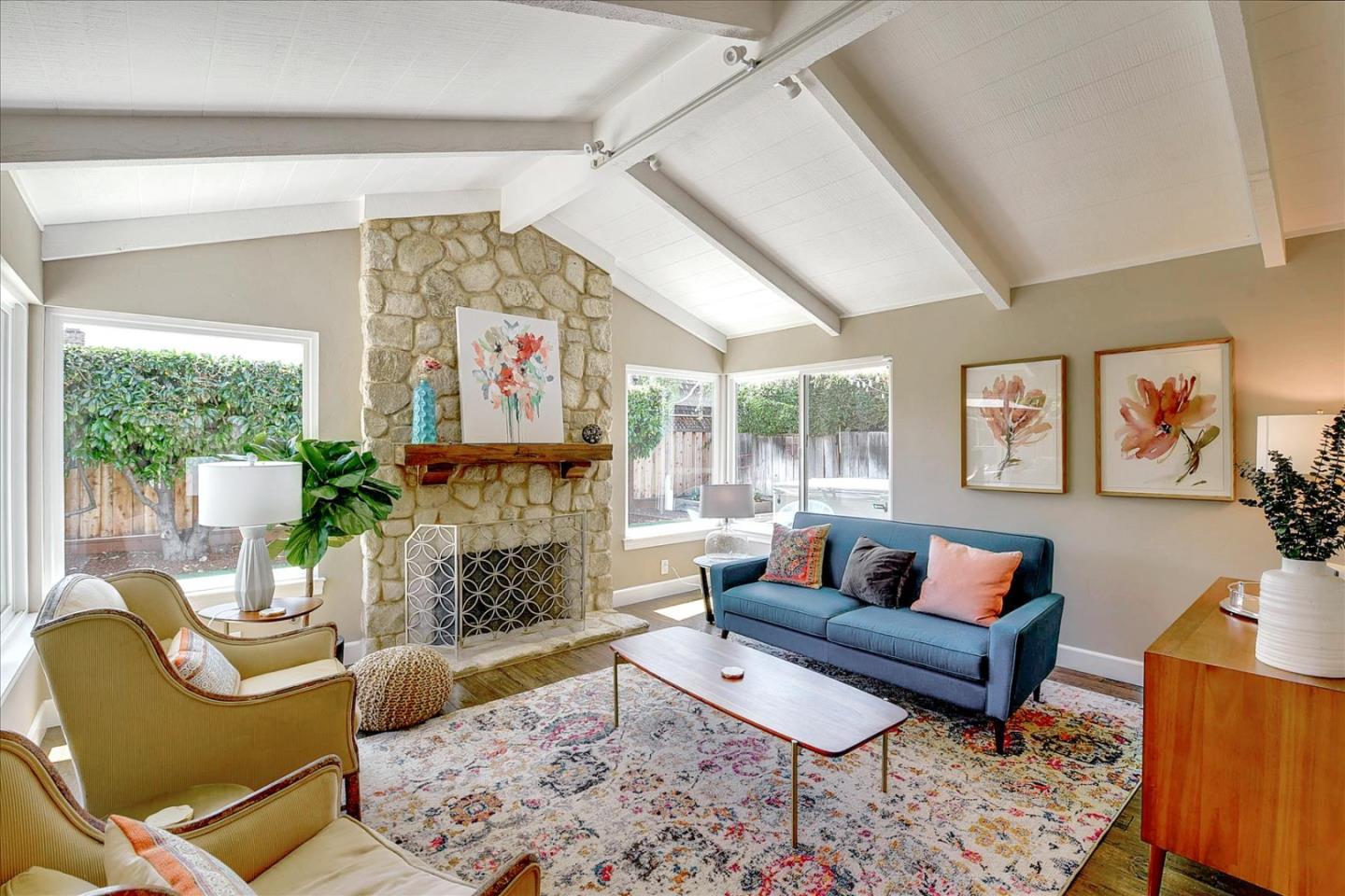 2215 Constitution Drive San Jose, CA 95124 - Photo 6 of 36 a living room with furniture a fireplace and a large window